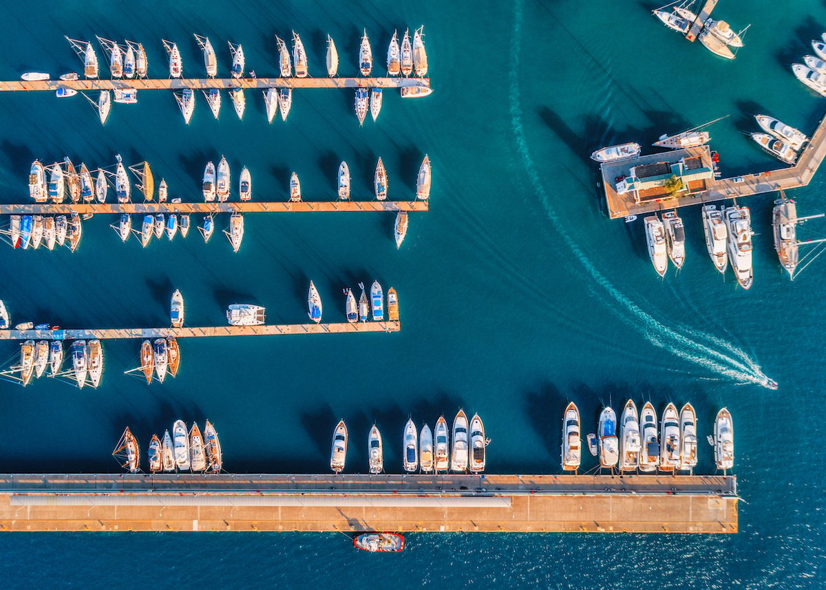 Aerial shot of boats parked at a marina. 